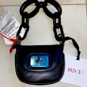 RED VALENTINO- adorable evening purse that has both hand and shoulder straps.